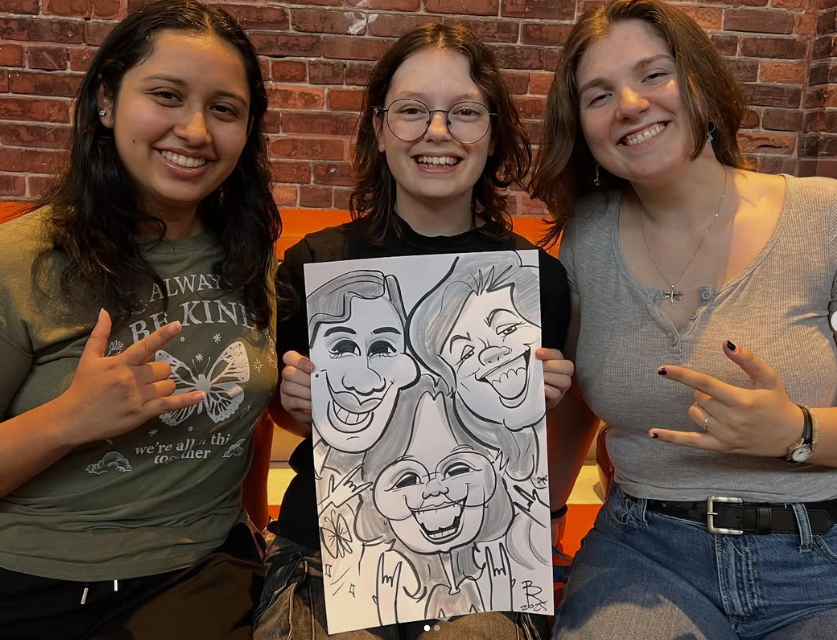 Three friends holding their live black and white group caricature — by Polina — Toronto, ON