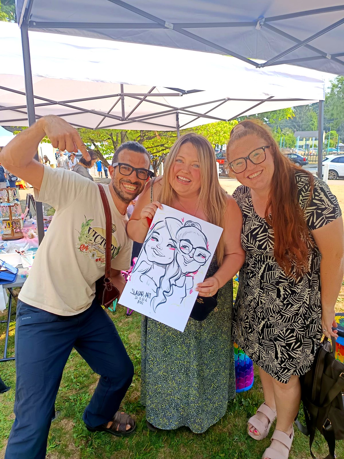 Guests laughing with their live duo caricature at a summer market — Greater Vancouver, BC