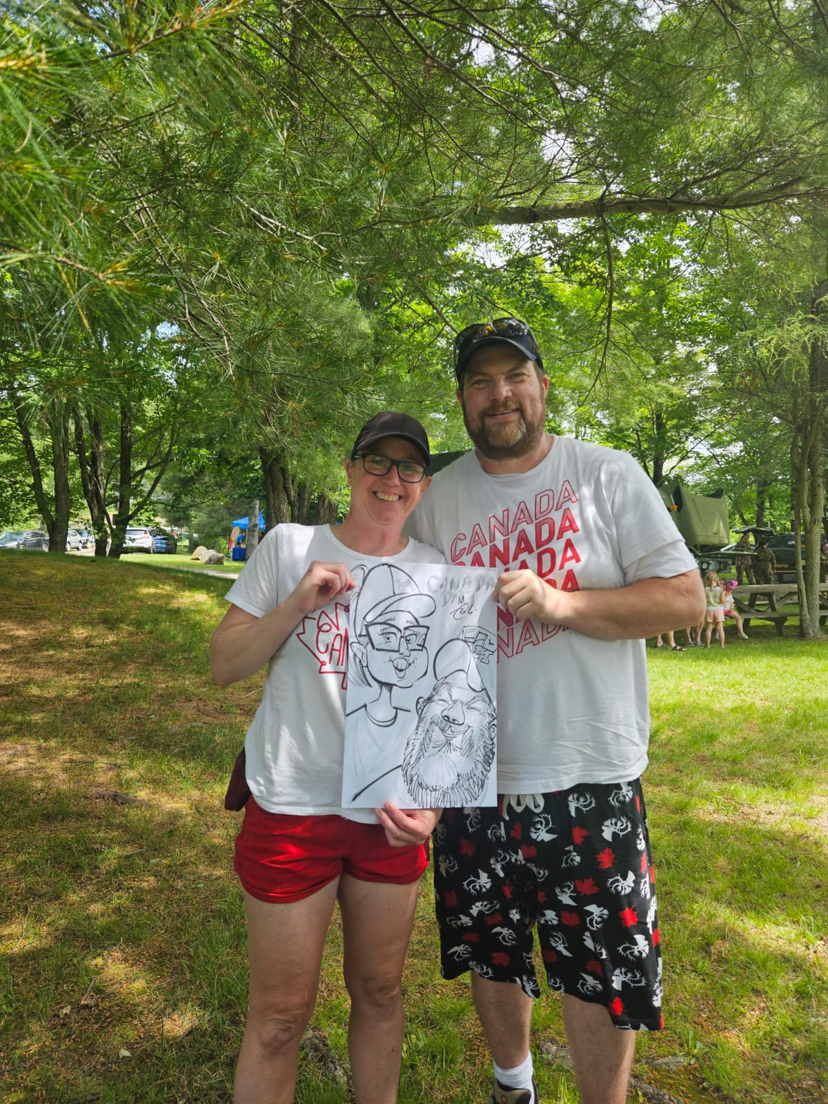 Couple with their Canada Day themed live caricature
