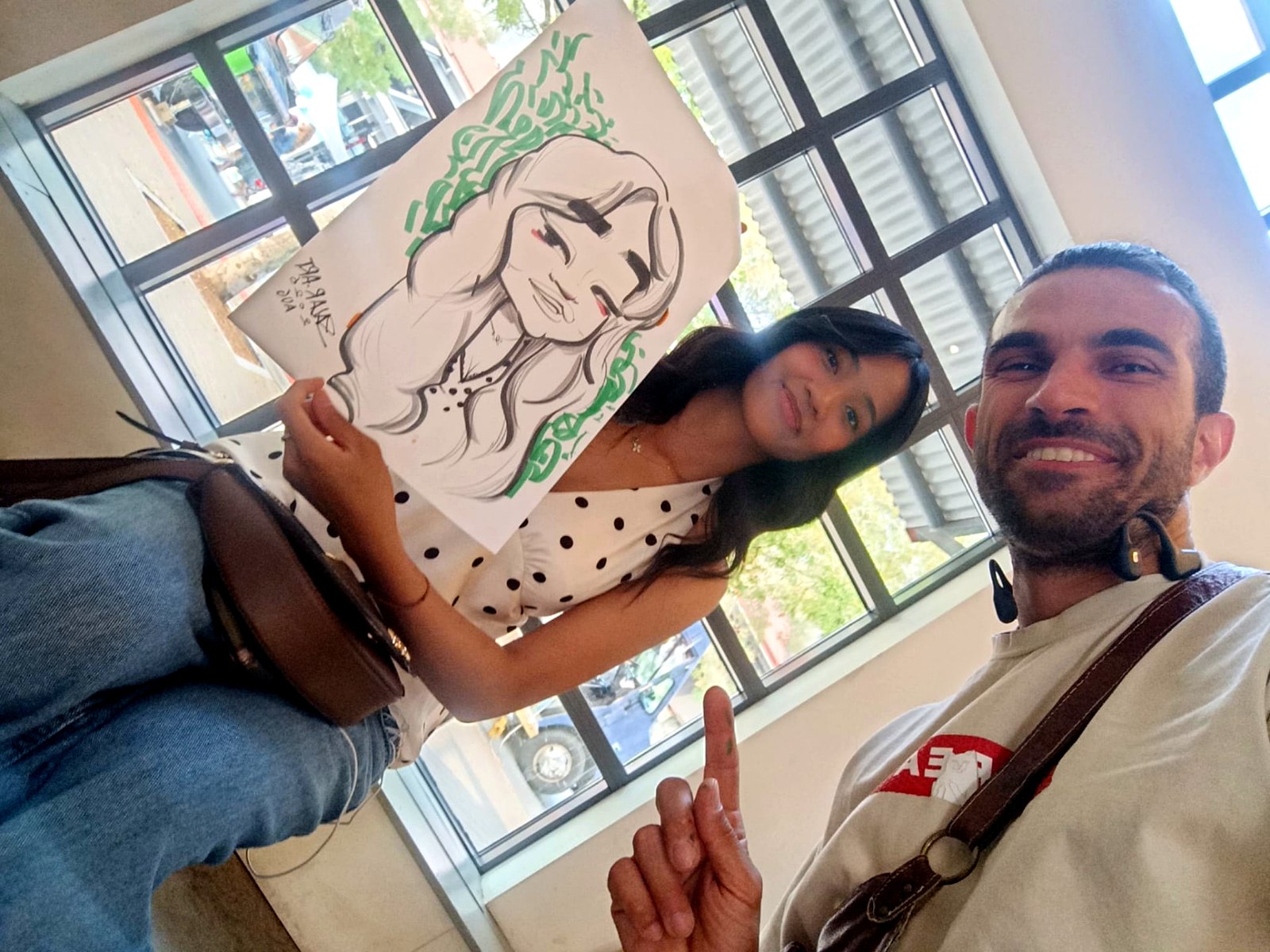 Green-ink live caricature handed to a happy guest — Vancouver, BC